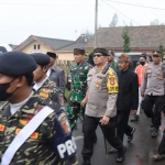 Kapolres Pasuruan AKBP Erick Frendriz (kacamata hitam) saaT menghadiri kegiatan Rakornas Banser dan Jambore Kemah Bhakti di Kecamatan Tosari, Kabupaten Pasuruan.