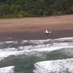 Pesawat latih milik API saat mendarat darurat di Pantai  Nganggelan, Alas Purwo, Kabupaten Banyuwangi.