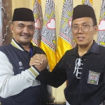 Asisten Pemerintahan dan Kesra Sekda Kota Kediri Syamsul Bahri (kiri) dan 
Ketua PSHT Cabang Kota Kediri Pusat Madiun, Kangmas Agung Sediana. Foto: Muji Harjita/BANGSAONLINE
