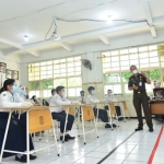 Dokumen simulasi sekolah tatap muka di SMPN 1 Surabaya.