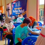 Pelaksanaan vaksinasi Covid-19 tahap kedua oleh Partai Nasdem Kabupaten Kediri di Balai Desa Krecek, Kecamatan Badas. foto: ist.