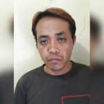 Tersangka Fadil yang diamankan polisi.