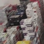 Tangkapan layar rekaman tumpukan rokok ilegal di sebuah rumah mewah di Madiun. Foto: Ist.
