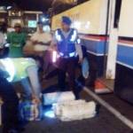 Petugas Polsek KP Tanjungwangi menyita puluhan liter arak Bali dari bagasi bus Indonesia Abadi, Kamis (22/9) pagi.