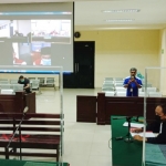 Sidang secara virtual di Pengadilan Tipikor Surabaya. foto: HERMAN/ BANGSAONLINE