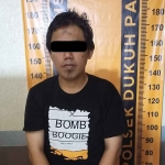 Teguh Edi Purnomo (36), pelaku pencurian dengan modus pemecahan kaca mobil di parkiran Apartemen Puncak Permai, Jalan Darmo Permai III, Surabaya.