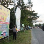 Sosialisasi larangan mudik melalui banner yang mulai terpasang di pinggir jalan Kecamatan Kedunggalar, Ngawi.