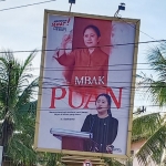 Baliho bergambar Puan Maharani yang dipasang DPC PDIP Gresik di Jalan Gubernur Suryo. foto: SYUHUD/BANGSAONLINE