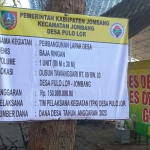 Papan informasi proyek pembangunan lapak Desa Pulo Lor, Jombang.