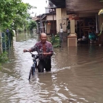 Banjir di Dusun Beluk, Desa Jombok, Kecamatan Kesamben, Jombang.