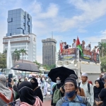 Massa aksi Reuni 411 saat berada di kawasan Patung Kuda Jakarta Pusat, Senin (4/11/2024). Foto: CNN