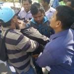Ahmad Fakih yang  pingsan  dan harus digotong untuk diberi pertolongan pertama dalam demo kemarin. foto: rizal/BANGSAONLINE