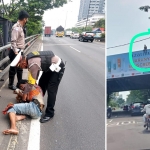 Sugeng ketika diamankan dan diturunkan dari Bilboard Tol Satelit dan hendak dibawa ke Polsek Sukomanunggal Surabaya, Sabtu (16/4/2022). Foto: NANANG/ BANGSAONLINE.com