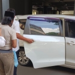 Tersangka UF (pakai kopyah)