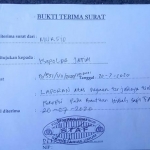 Surat bukti lapor ke Polda Jatim. (foto: ist).