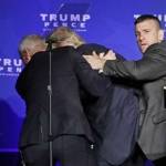 Agen Secret Service mengungsikan capres Donald Trump dari panggung.