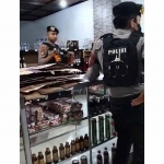 Petugas saat melakukan inspeksi mendadak ke sebuah toko yang menjual minuman keras di Jember. Foto: Ist