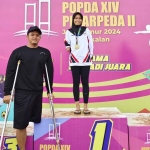 Tiga atlet paralimpik dari Kota Kediri yang berhasil meraih medali pada Peparpeda II Jawa Timur 2024. Foto: Ist