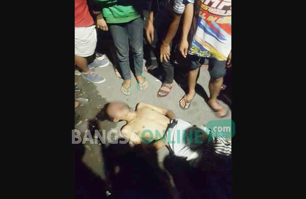Kondisi pelaku jambret yang peyok usai dimassa,