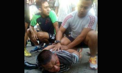 Tersangka diamankan warga usai kepergok.