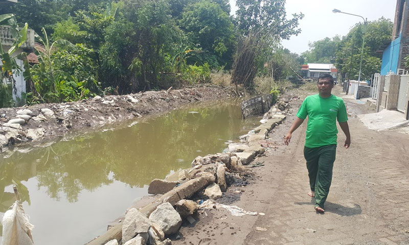 Tanggul yang jebol pasca diguyur hujan di Tebel Cangkringmalang, Beji.