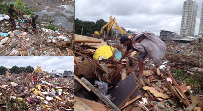 Ratusan pemulung tampak memunguti sisa-sisa bekas penertiban kawasan Kalijodo. Mereka diusir aparat Satpol PP karena alat berat masih diterjunkan untuk meratakan dan membersihkan sampah bekas pembongkaran, Selasa (1/03/2016). foto: rakisa/ BANGSAONLINE