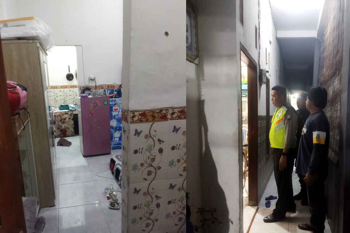 Petugas dari kepolisian saat penyelidikan dalam kasus penekapan terhadap PSK asal Surabaya di Kos Sidoarjo.