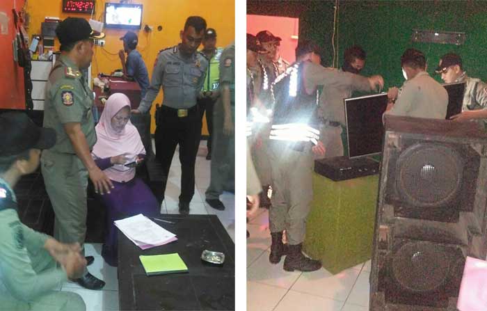 Petugas saat menggerebek usaha karaoke ilegal milik Naim.