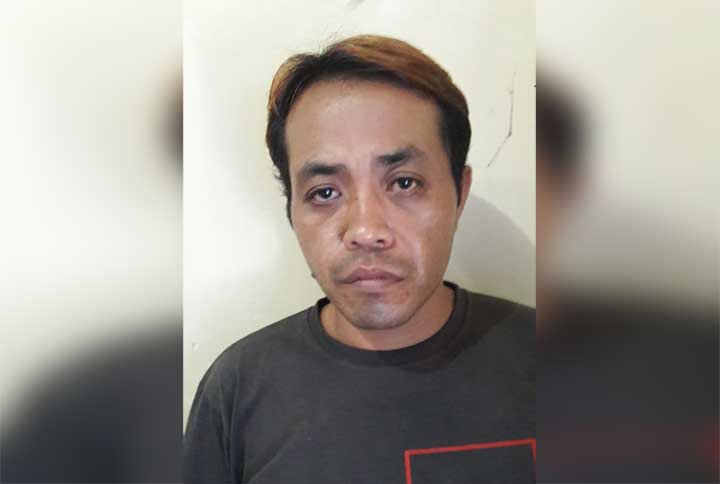 Tersangka Fadil yang diamankan polisi.