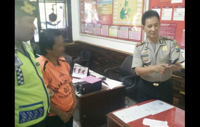 Kusnan saat diperiksa polisi.