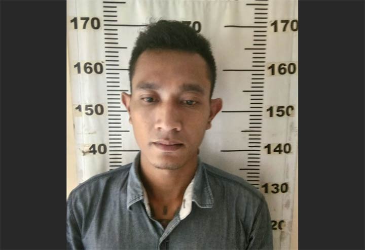 Tersangka saat diamankan di Mapolresta Sidoarjo.