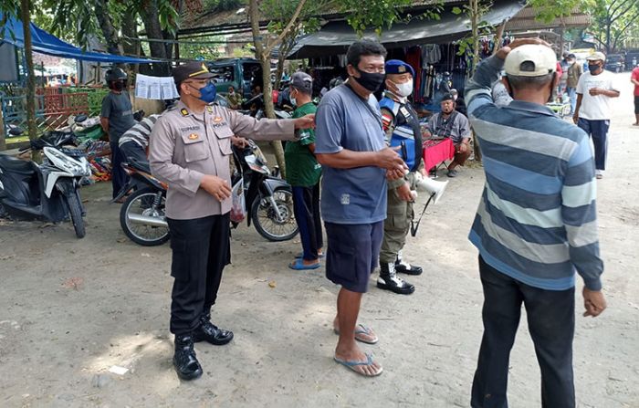 Tegakkan Prokes, Pamor Keris Polres Ngawi Sasar Pasar Hewan 