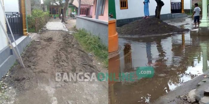 Pavingisasi di jalan Desa Pulo Lor, Kecamatan/Kabupaten Jombang dihentikan warga lantaran terindikasi ada penyelewengan. foto: ROMZA/ BANGSAONLINE