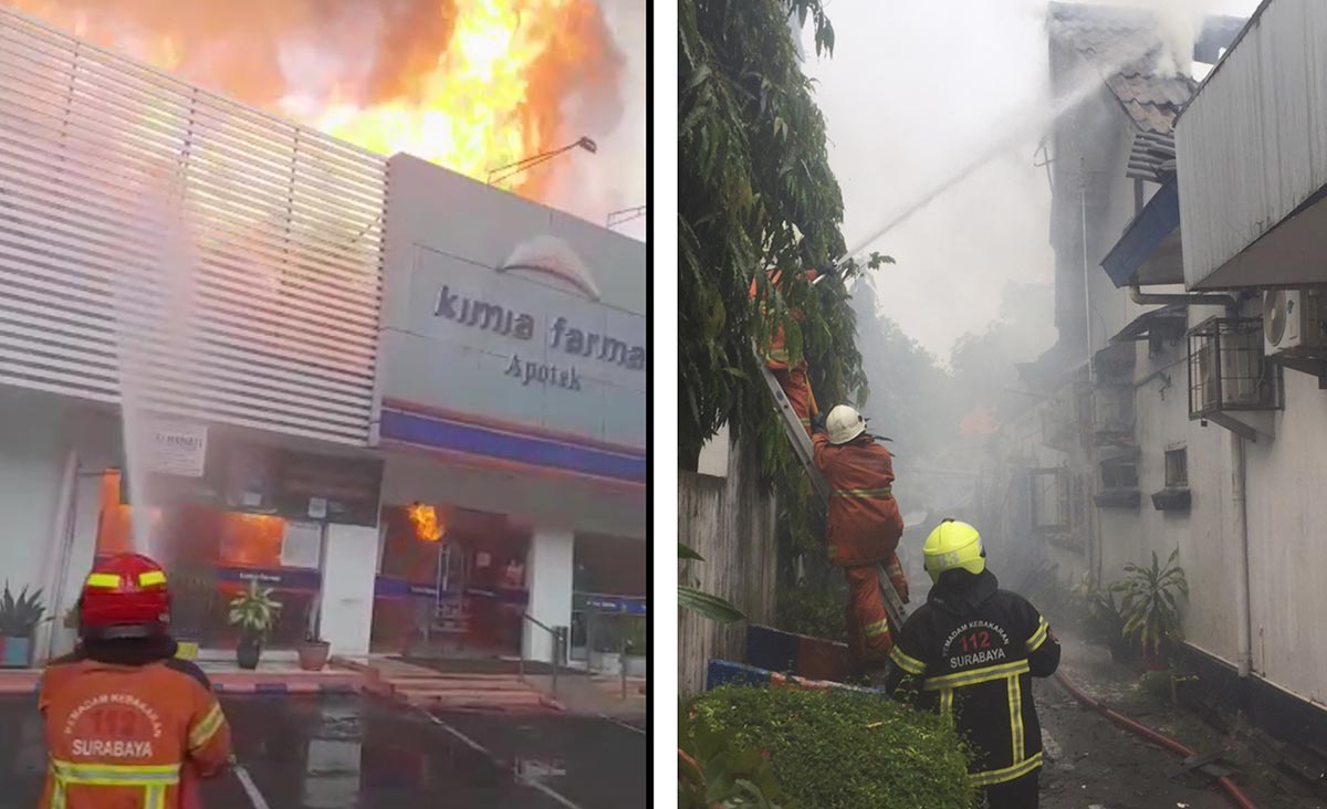 Petugas pemadam kebakaran (PMK) saat melakukan pemadaman Apotek Kimia Farma Diponegoro, Surabaya.