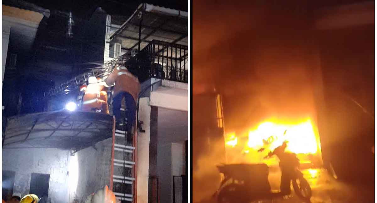 Petugas damkar saat menyelamatkan korban yang terjebak kebakaran.