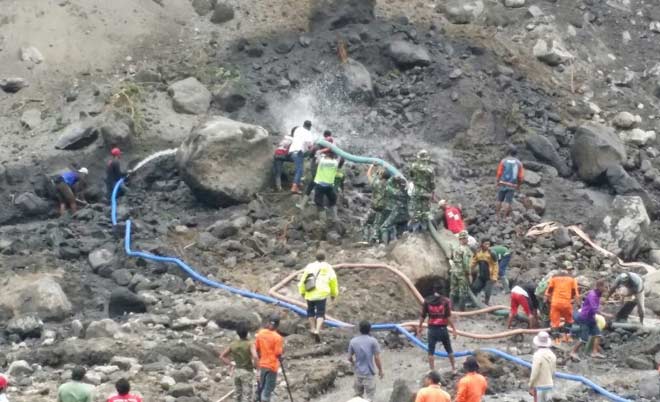 Lokasi tertimbunya truk pasir beserta pengemudinya di Kali Putih.