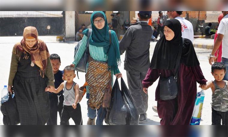 Sejumlah WNI akhirnya lari dari ISIS. ©AFP PHOTO/AYHAM AL-MOHAMMAD