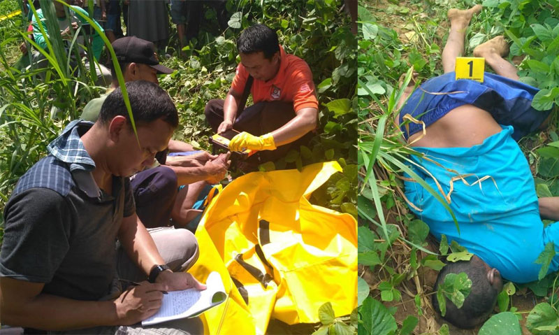 Petugas saat mengidentifikasi korban sebelum dievakuasi.