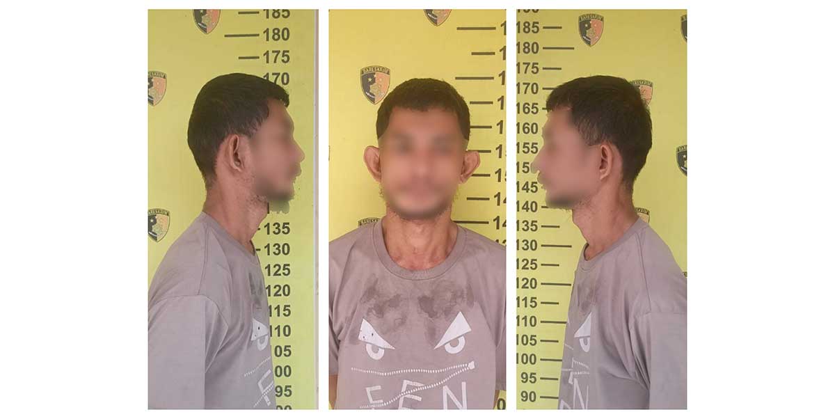 Penadah motor curian saat berada di Mapolsek Wonocolo.