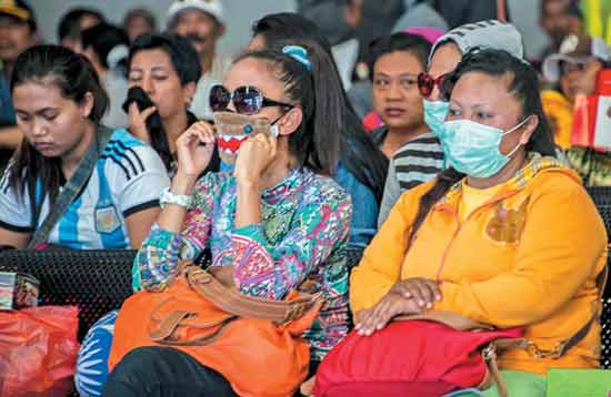 Para PSK yang dipulangkan dari Tanjung Elmo, Jayapura, saat tiba di Tanjung Perak. (foto: koran sindo)