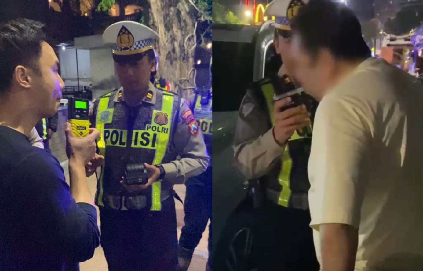 Polisi saat merazia pengemudi yang mengonsumsi alkohol menggunakan Alcohol Breath Analyzer
