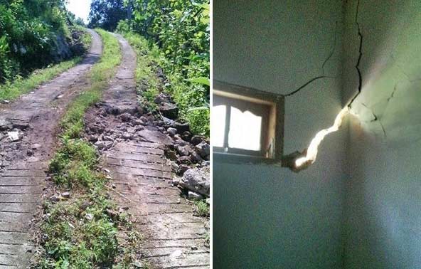 Tanah gerak mengakibatkan jalan ambles dan tembok rumah warga retak. 