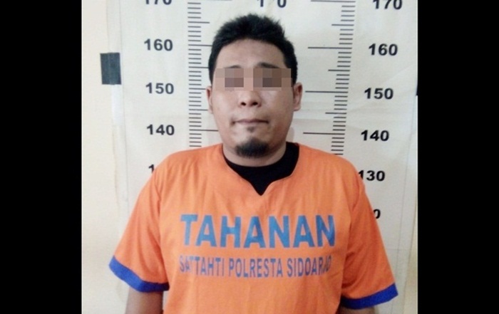Tersangka Fiqih (34), warga Jalan Wedoro Belahan 7, Desa Wedoro, Waru, Sidoarjo.