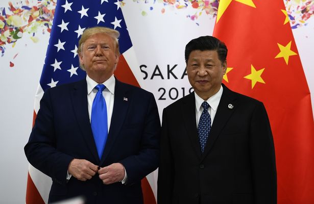 Donlad Trump dengan Presiden China Xi Jinping (Image: AFP via Getty Images)