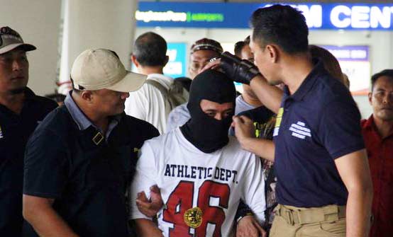 Kusmayadi alias Agus pelaku mutilasi wanita hamil di Desa Telagasari, Cikupa, Kabupaten Tanggerang, tiba di Bandara Soetta.