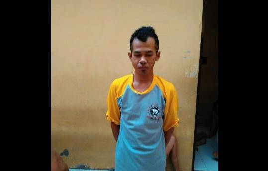 Asrul saat diamankan di Polsek Taman. 