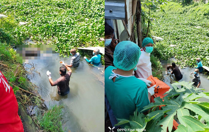 Petugas sedang mengevakuasi mayat seorang pria tanpa identitas tersebut.
